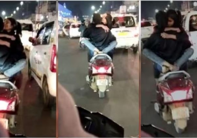 Couple Romace On Moving Scooty